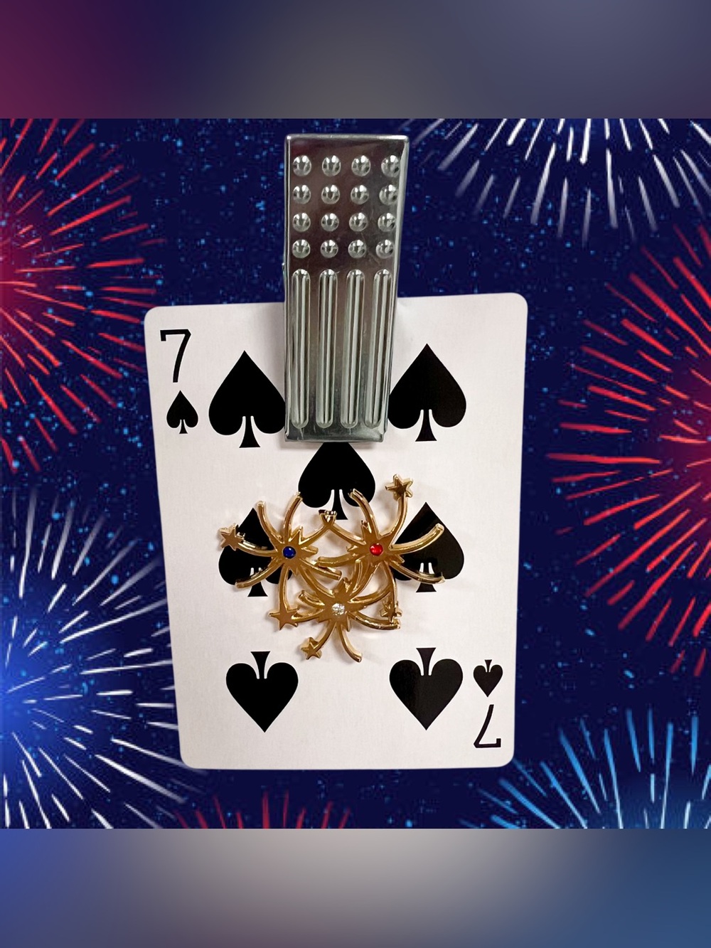 Vintage gold fireworks brooch with red white and blue crystals